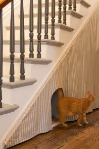 cat box under stairs